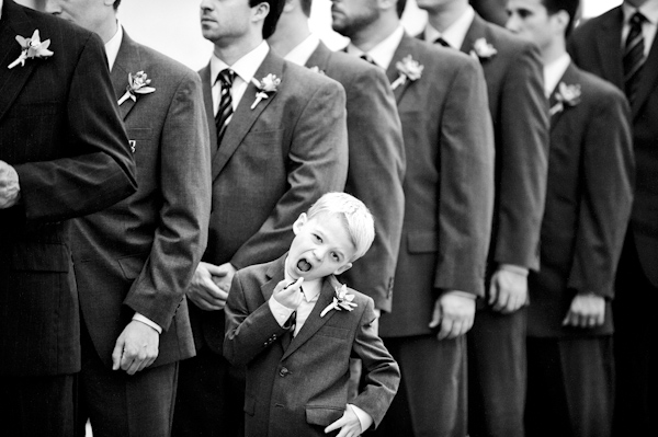 ring bearer makes faces during ceremony - wedding photo by top Atlanta based wedding photographers Scobey Photography
